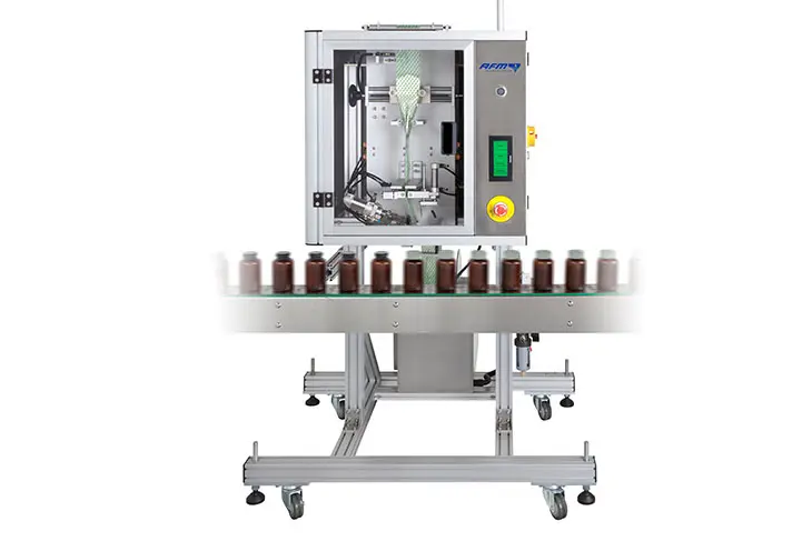 Machine for shrink sleeves