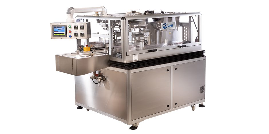 Automated industrial machine with safety enclosure and control panel.