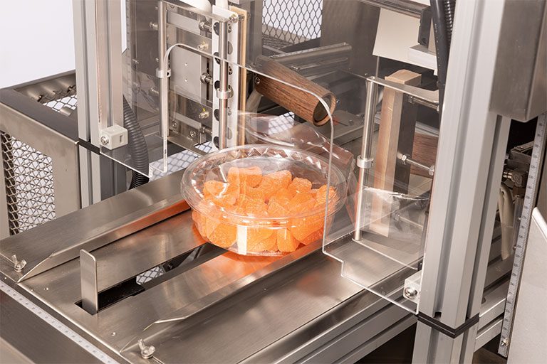 Manual tamper evident band applicator